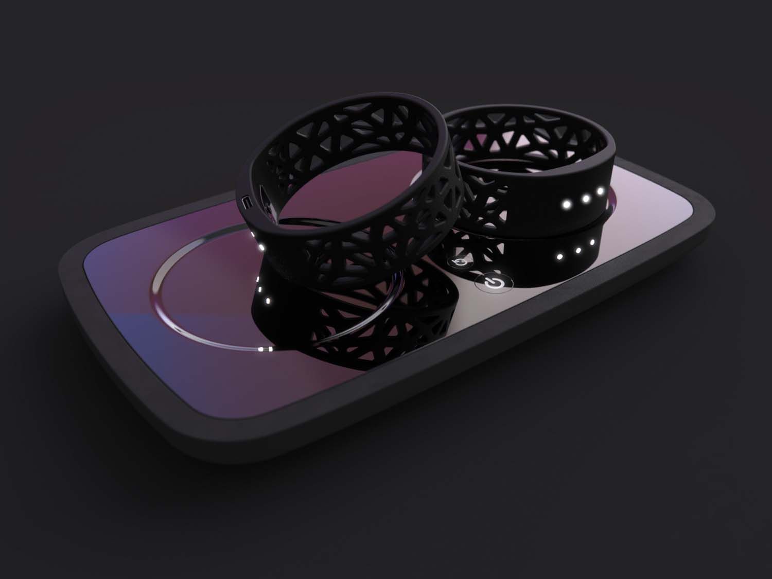 A pair of black, lattice-patterned VR tracking rings sitting on a smartphone-shaped charging dock.